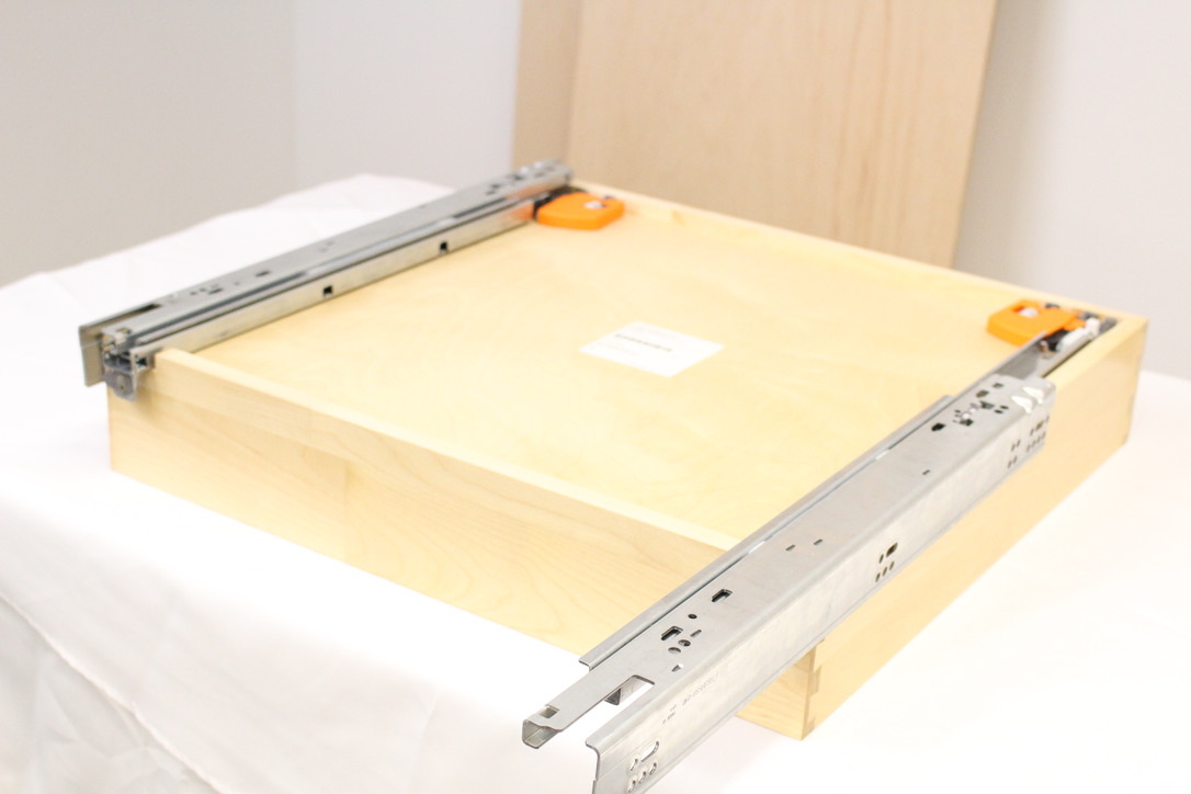 Step 1: Attach drawer glides to drawer boxes