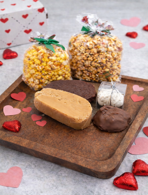 Valentines holiday cheer confection gift box on wood tray