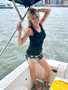 Beautiful Natalie Oliveras wearing floral Ojo Fashions Jenny Shorts on a boat