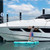 Solstice Luxe Tract Inflatable Dock 8' x 5' x 8"  - man utilizing dock for cleaning his boat hull
