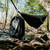 Mission CASSI Dual Compartment 18L Backpack hanging on a hammock in the woods