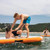 Two men playing on a Mission REEF 85 Inflatable Water Mat Essentials Kit