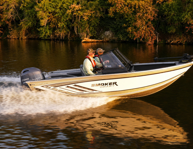 A boat under way powered by a Yamaha outboard engine