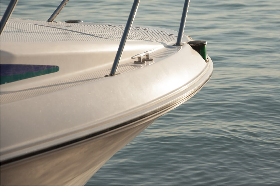 Closeup of a boat's rub rail out on the water