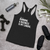 Black slogan tank top with text "Running a business is my cardio" front view laying flat.