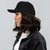 B Mark Trucker Hat left view on a model.