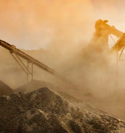 Dust and debris on a quarry conveyor and crusher