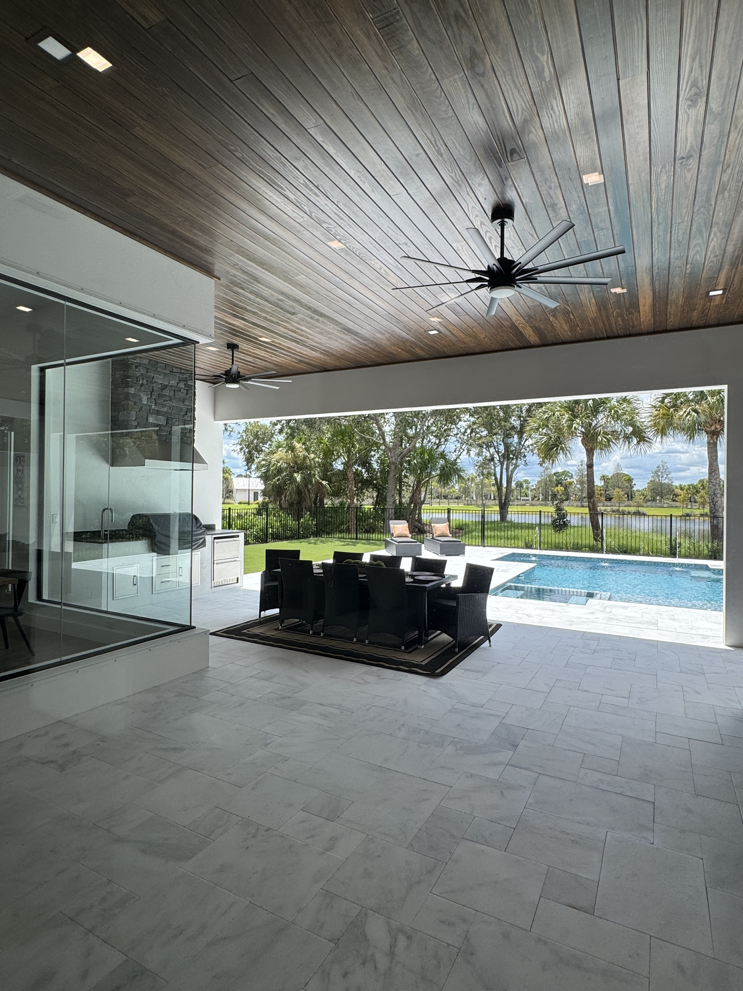 outdoor patio under covered section with white stone tile