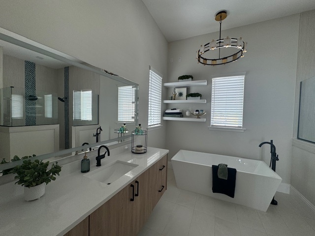a modern bathoom with white tile floor a stand alone bathtub and a full length mirror with a circular chandelier hanging above the bathtub