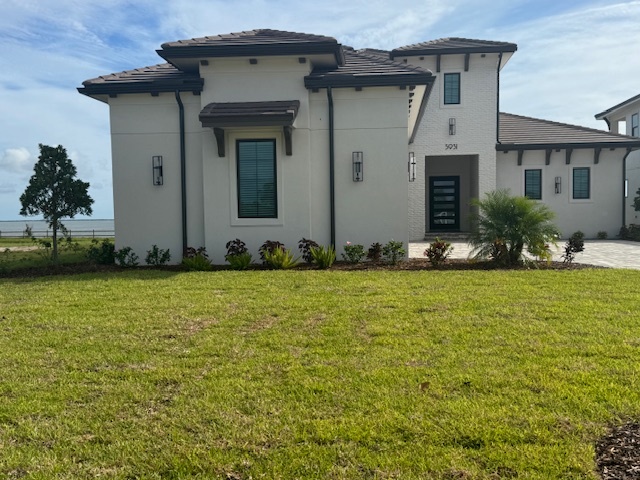 The side of a modern stucco house