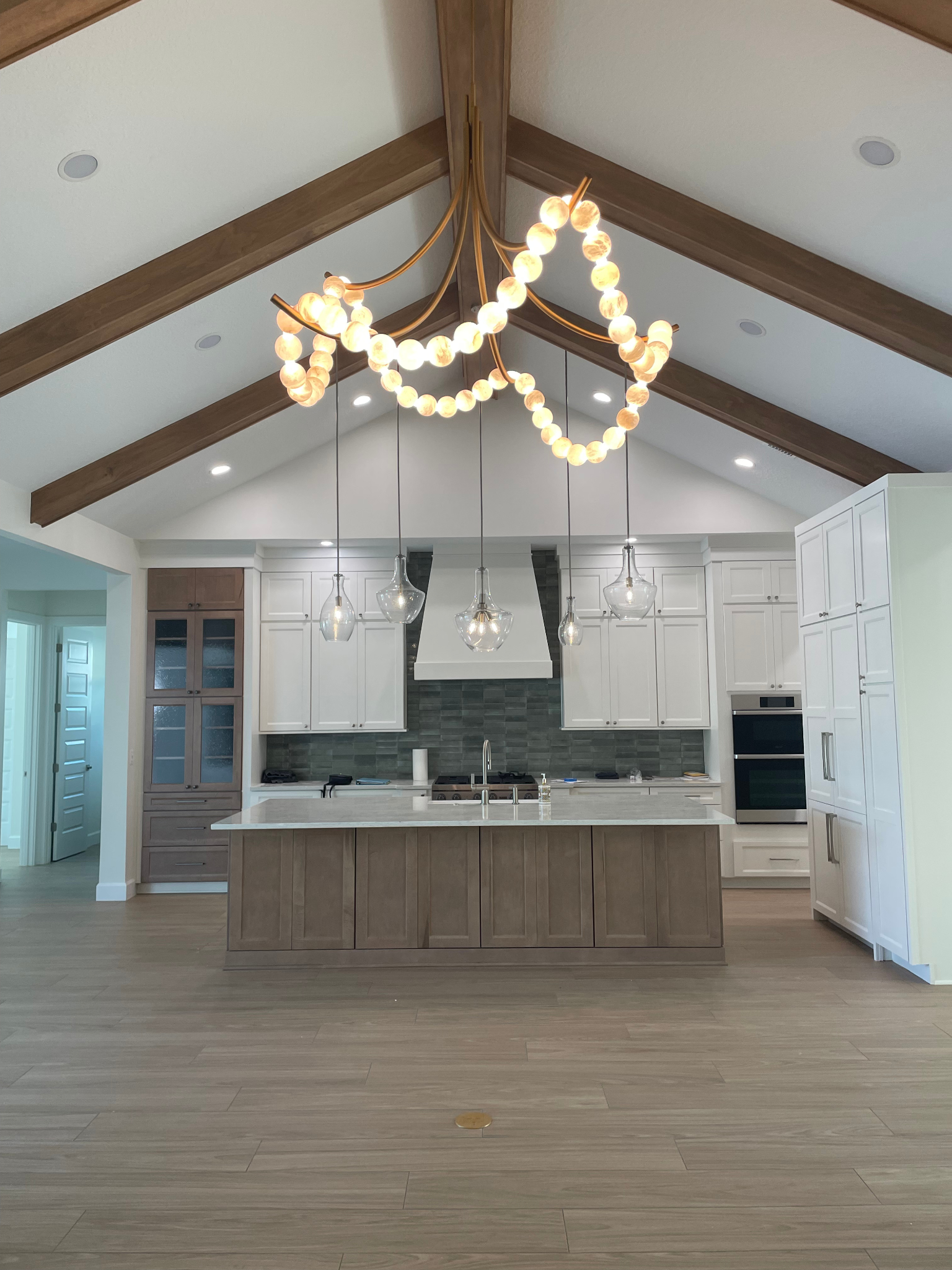 hanging kitchen chandelier with ball rope lights draped across it