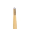 close up of the narrow tip of a brown pre rolled cone showing the rolled paper filter inside