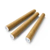 three brown one hundred nine millimeter pre rolled cones pointing upwards on white background