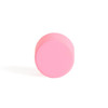 front face of a round pink cap for glass pre roll tubes tilted toward the viewer