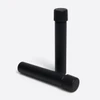 glass pre roll tubes in a smooth black finish with one standing and one lying on its side