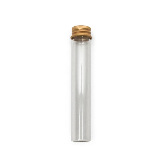 empty clear glass pre roll tube with a gold ribbed screw cap standing upright on white