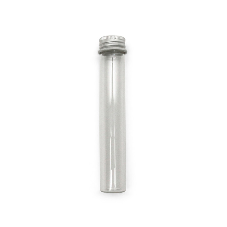 empty clear glass pre roll tube with a ridged silver aluminum screw cap on a white background