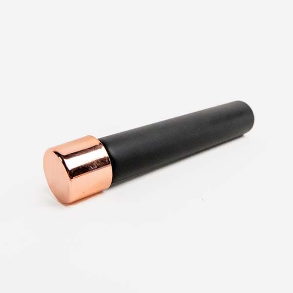 Rose gold child resistant cap with black glass pre roll packaging tube