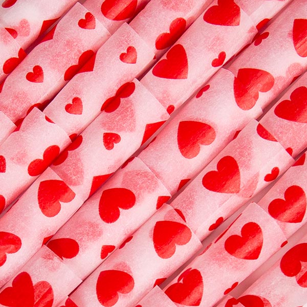 A closeup of the heart printed paper pre-rolled cones