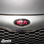 Top Down Straight on view of Carbon Fiber with Gloss  Pink Kia Logo for 2014-2016 Kia Forte Hatch