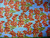 RED LILIES ON LIGHT BLUE FABRIC