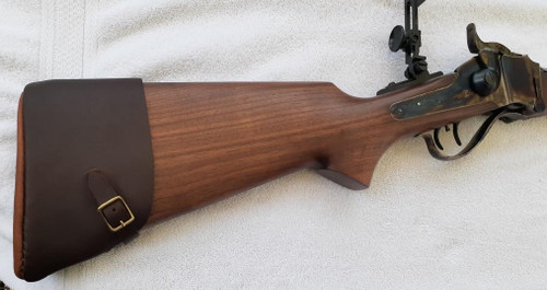 Accu-Riser BP-2000 Leather Butt Pad on a Sharps Black Powder Cartridge rifle. These are made for flat or very slight curved butt stocks. However with some extra neoprene padding can be trimmed to accommodate a hooked butt plate. Call us to discus  how to make it work on a hooked butt plate.