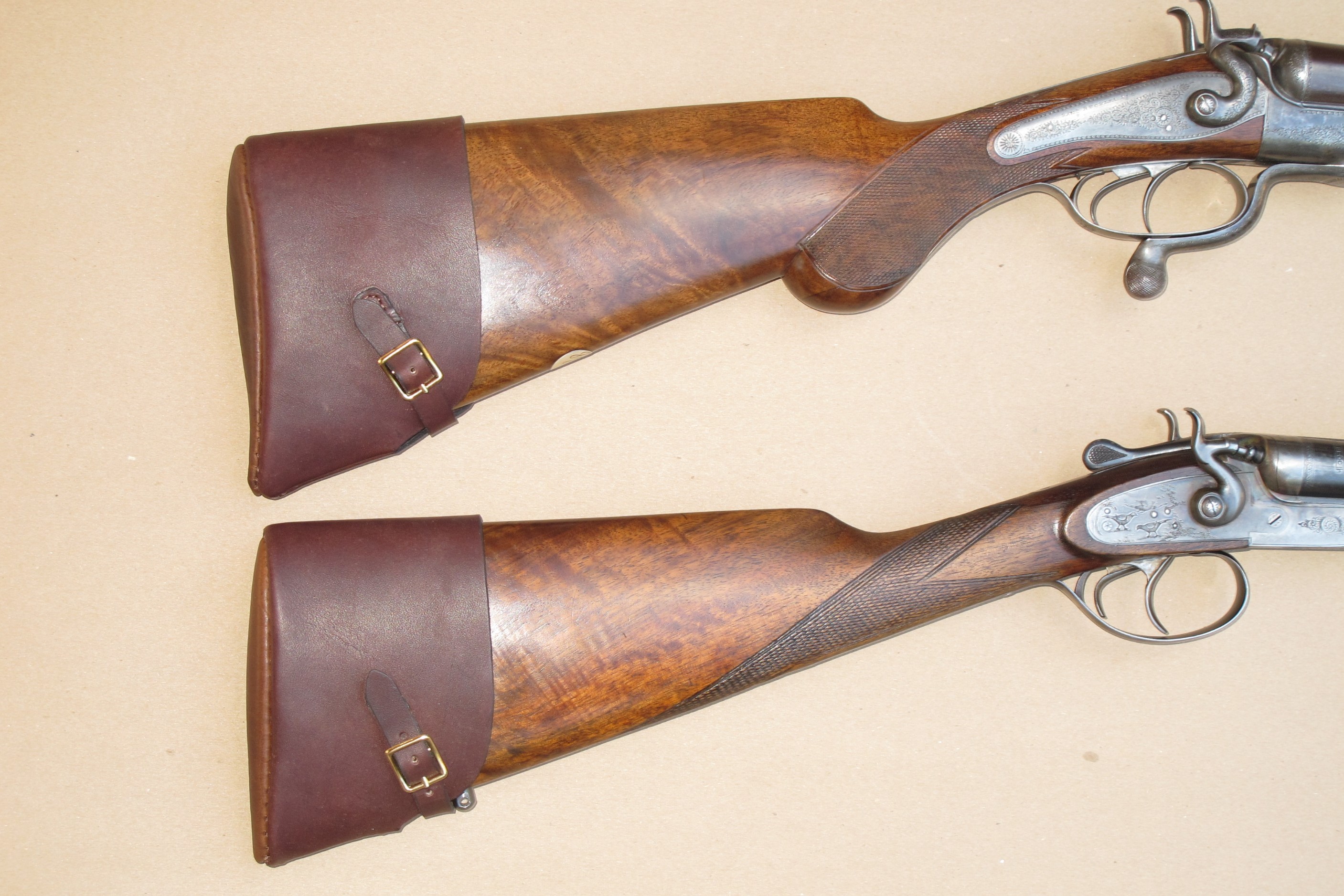 accu-riser-cp-5000s-neoprene-cheek-pad-on-two-old-classic-shotguns.jpg