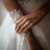 Cushion Diamond Tapered Cathedral Open Bridge Three-Stone Engagement Ring in Rose Gold (MVSX1050-R)