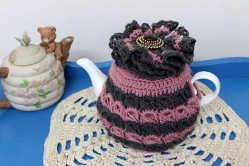 CMPATC093  Crocheted teacosy for 4 cup pot featuring bands of contasting broomstick crochet.