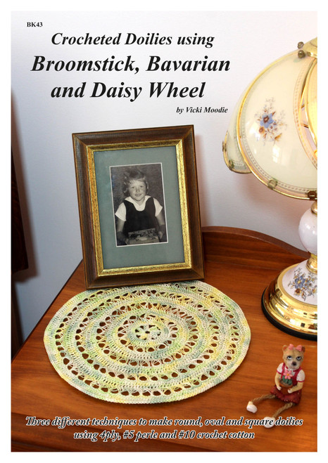 Front cover of Craft Moods publication BK43 (A4), Crocheted Doilies using Broomstick, Bavarian and Daisy Wheel, by Vicki Moodie (Australian), three different techniques to make round, oval and square doilies using 4ply, #5 perle and #10 crochet cotton.