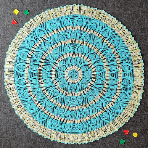 Image of finished shawl from Craft Moods book BK55 Cosy Rugs to crochet for your Bub Pattern 1, Pineapple shawl in the round.