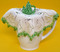 Jug cover with teapot centre shown on jug