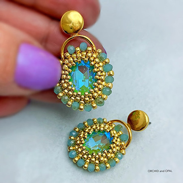 Beautiful earrings featuring a bezeled pair of Krakovski Oval Fancy Stones in Pacific Opal and  the Venio II Cymbal Earring components ✨