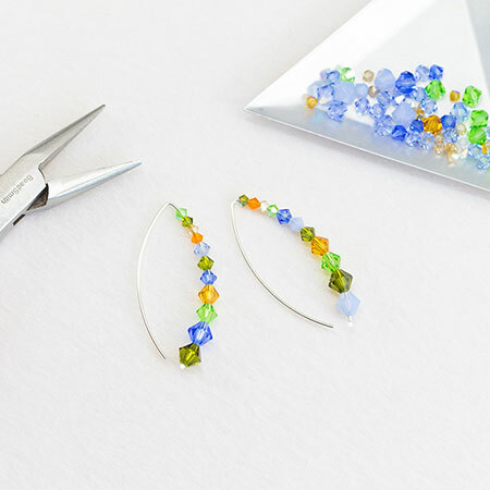 The Emerging Spring Caret Earrings