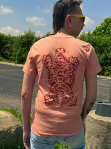 Full back of Eat The Rich t shirt on male model, displaying tibetan tiger rug design