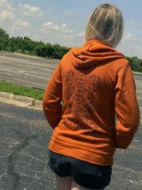 Full back of Eat The Rich hoodie on female model, showcasing tibetan tiger rug print