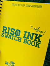 Cover of Riso Ink Swatch book in yellow with teal ink & spot gloss showing the detail of the print
