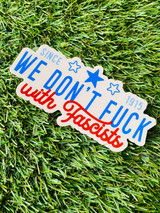 Vinyl sticker on grass background that states "We don't fuck with fascists" Sticker option d