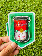 Antifa Soup can sticker over a grass background in a hand