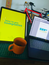 How To Use Templates e-book cover on an iPad  next to a computer with an art print template up