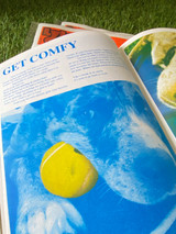 Example image of a page inside the zine. of a image printed in blue with a yellow tennis ball in a dogs mouth