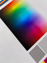 Image of paper with a color calibration chart and the paper texture