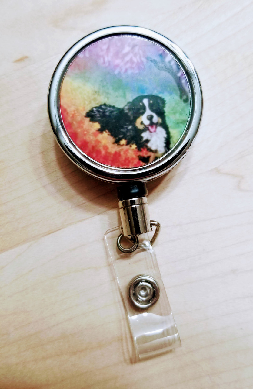 https://cdn11.bigcommerce.com/s-6w130w/images/stencil/1280x1280/products/11181/40595/tranquil_garden_bernese_mountain_dog_badge_reel__91892.1651792919.jpg?c=2