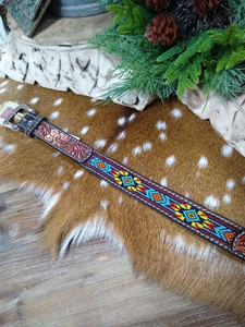 From the maker of Twisted-X belts comes this classic kid's belt with brown & black tooled leather and multi-colored beading. From the maker of Twisted-X belts comes this classic kid's belt with brown & black tooled leather and multi-colored beading.