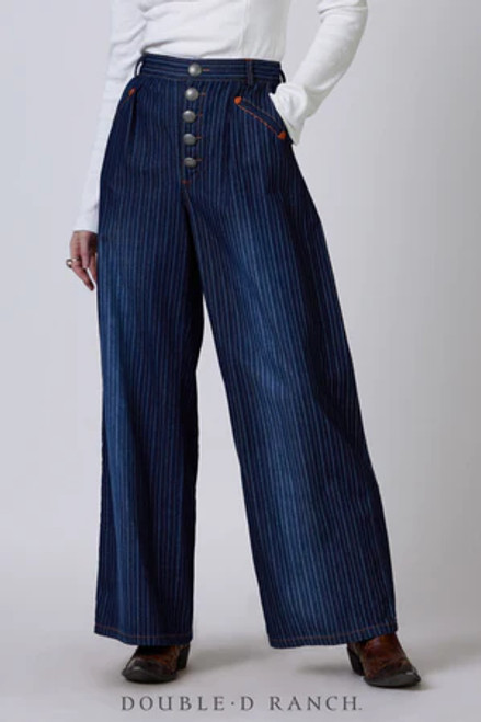 SWOON-WORTHY STRIPES.
Wide-leg trousers are the peak of chic and this pinstripe pair is embracing the trend with a stockyard-style spin. The lightly distressed denim boasts subtle vertical stripes that are flattering and elongate the legs, complementing the straight-leg silhouette. They’re finished with cool cowgirl details like western welts and a 5-button fly of custom concho buttons.
color: denim
content: 100% cotton
embellishments: custom Double D button
size: 4
fit: relaxed
style number: P573
collection: Cowpoke U