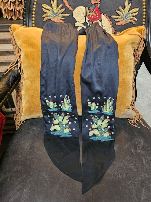 Enjoy this bold, soft scarf from Double D Ranch.  

Shop Affordable, Best Price and Deals on Fashion Clothing at Pilot Point Feed Store.  Always find Trendy, Stylish and Popular clothing in our Boutique!

Black tie style scarf with embroidered multicolored cactus and rhinestone accents

56"x5"