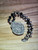 Hand carved 2 inch sacred heart dyed black
3 total inch scrolled silver setting with floral engraving on back
18 inch woven cord with alternating onyx and metal beads