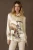UPSCALE APPEAL WITH STRONG WESTERN ROOTS.
This beautiful blouse is bound to be a fan favorite from Midland to Mount Pleasant (and all over the country, of course). It’s a sleek silk emblazoned with a distinctly Western oil field scene – complete with a regal steed – crafted in a chic silhouette and finished with askew squared pearl snaps. It’s got an heir of elegance and old money and it’s going to be a lot more versatile than you might think!

color: bone
content: 95% silk, 5% elastane
embellishments: custom print, snap closure
fit: relaxed fit, length below hip
T4242
collection: Roughneck Rodeo
In stock