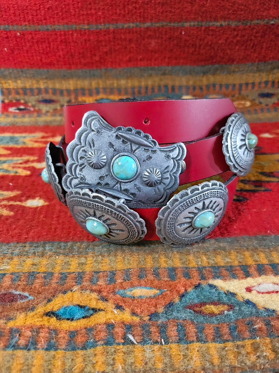 Y’all know how we feel about concho belts: you’ve gotta have at least one, and you can never have too many! This classic concho belt features a slender leather strap adorned with a series of stamped silver scallop-edged conchos with turquoise center stones. Available in red, brown, and turquoise, the Balcones is going to make a gorgeous addition (or three!) to your collection.

Shop Best Price and Affordable Double D Ranch Fashion Clothing at Pilot Point Feed Store.  Trendy, Stylish and Popular!

buckle closure
buckle dimensions: 2"H x 2-3/4"W 
silver scalloped conchos with turquoise stones
concho dimensions: 1-3/4"H x 2-3/8"W
leather
Style:  FA720TQ
Red