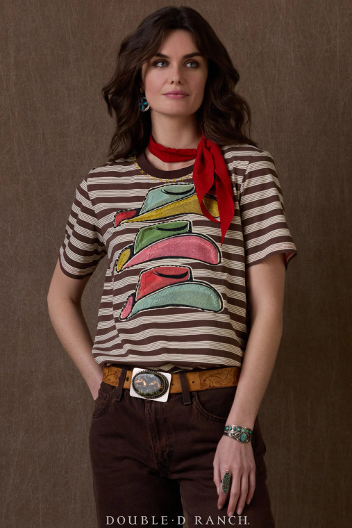 CHEEKY NAME, CHARMING TOP.
 
If you’ve been around these parts awhile, you’ve probably heard a cowboy hat referred to as a Texas toupee once or twice (and it’s funny because it’s true). Well, we’ve turned that ol’ cliche into the cutest little cotton tee! The chic brown stripes give it an upscale, almost Parisian look, and the colorful cowboy hats bring it to life.
color: stripe
content: 100% cotton
embellishments: embroidery, printing
fit: Relaxed fit, a-line body
style number: T4104
collection: Atomic Ranch CHEEKY NAME, CHARMING TOP.
 
If you’ve been around these parts awhile, you’ve probably heard a cowboy hat referred to as a Texas toupee once or twice (and it’s funny because it’s true). Well, we’ve turned that ol’ cliche into the cutest little cotton tee! The chic brown stripes give it an upscale, almost Parisian look, and the colorful cowboy hats bring it to life.
color: stripe
content: 100% cotton
embellishments: embroidery, printing
fit: Relaxed fit, a-line body
style number: T4104
collection: Atomic Ranch